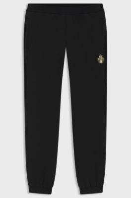 Year of the Horse Cotton-terry tracksuit bottoms with logo artwork, Black