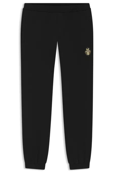 Cotton-terry tracksuit bottoms with logo artwork