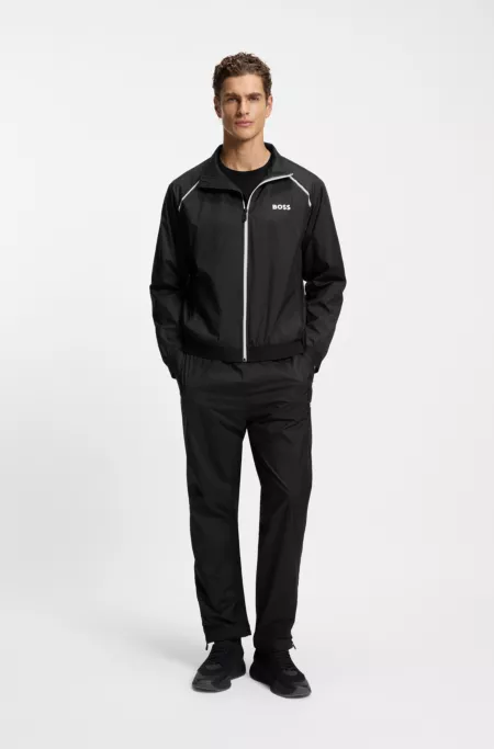 Survêtement deux pièces sportif déperlant avec fermeture éclair au bas des jambes