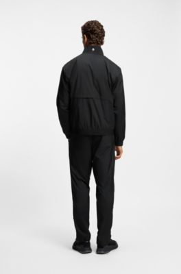 Active water-repellent two-piece tracksuit with zip hems, Black