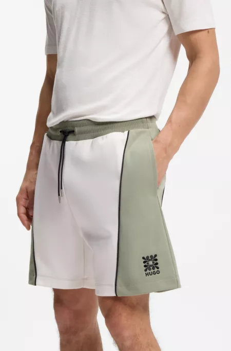 Cotton-blend shorts with embroidered logo artwork