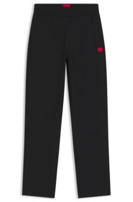 Tracksuit bottoms in stretch jersey with red logo label 4