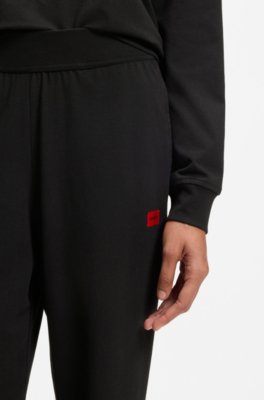 Tracksuit bottoms in stretch jersey with red logo label 2