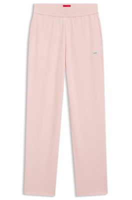 Tracksuit bottoms in stretch jersey with red logo label, light pink