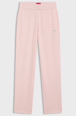 Tracksuit bottoms in stretch jersey with red logo label, Light Pink