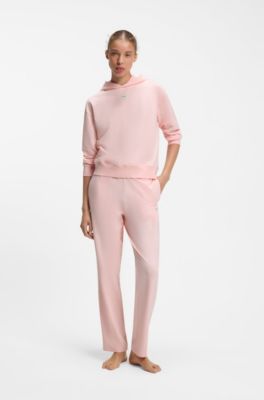 Tracksuit bottoms in stretch jersey with red logo label, Light Pink