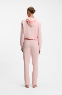 Tracksuit bottoms in stretch jersey with red logo label, Light Pink