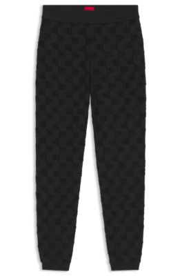 Bas de surv&ecirc;tement en coton m&eacute;lang&eacute; avec motif de logo partout, Noir