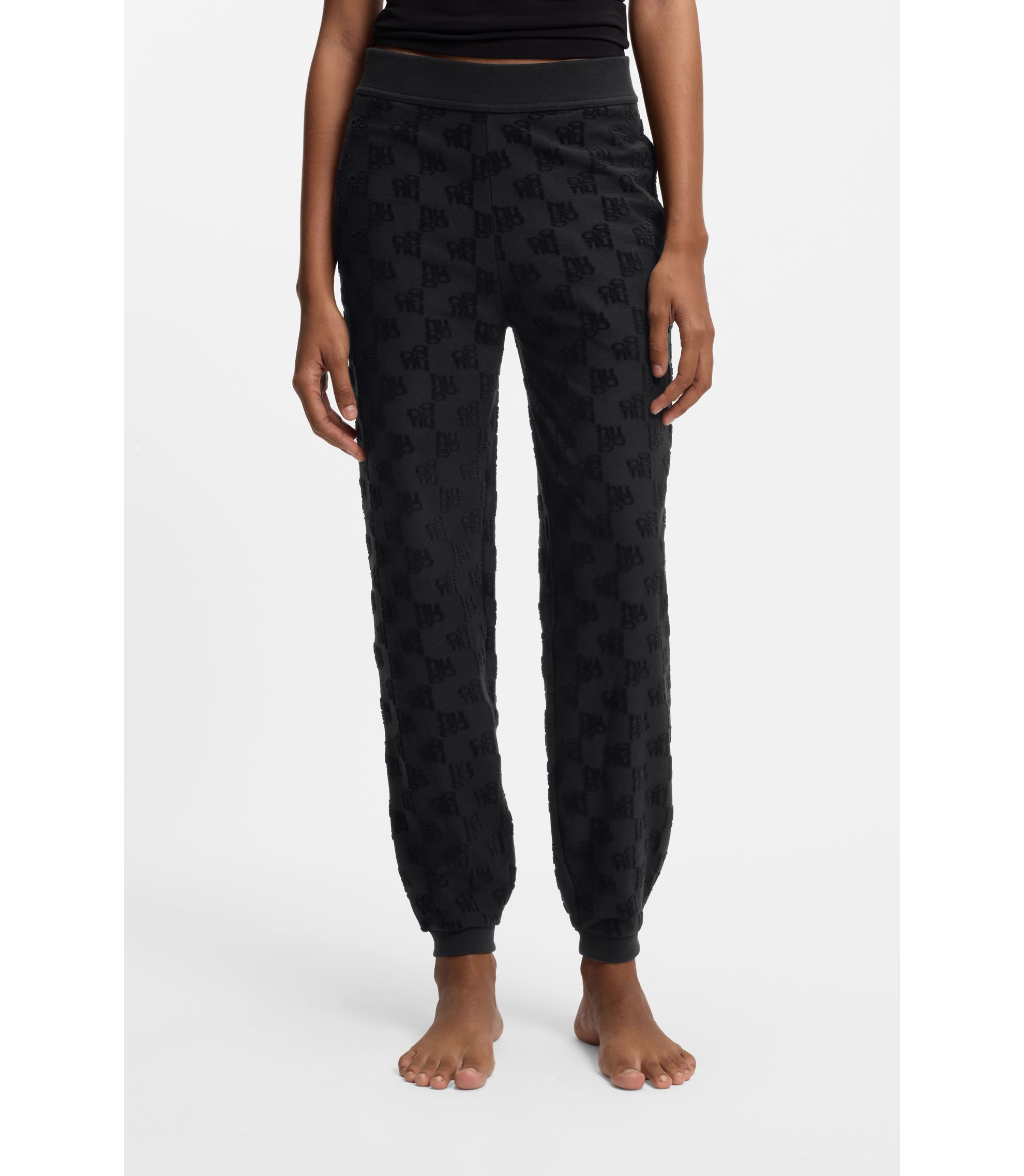 Jogginghose aus Baumwoll-Mix mit Allover-Logo-Muster