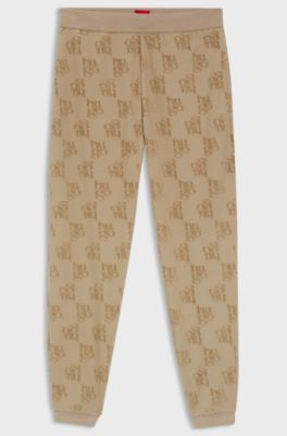Cotton-blend tracksuit bottoms with all-over logo pattern, Light Brown