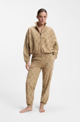 Cotton-blend tracksuit bottoms with all-over logo pattern, Light Brown
