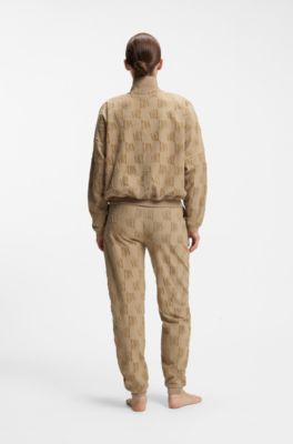 Cotton-blend tracksuit bottoms with all-over logo pattern, Light Brown
