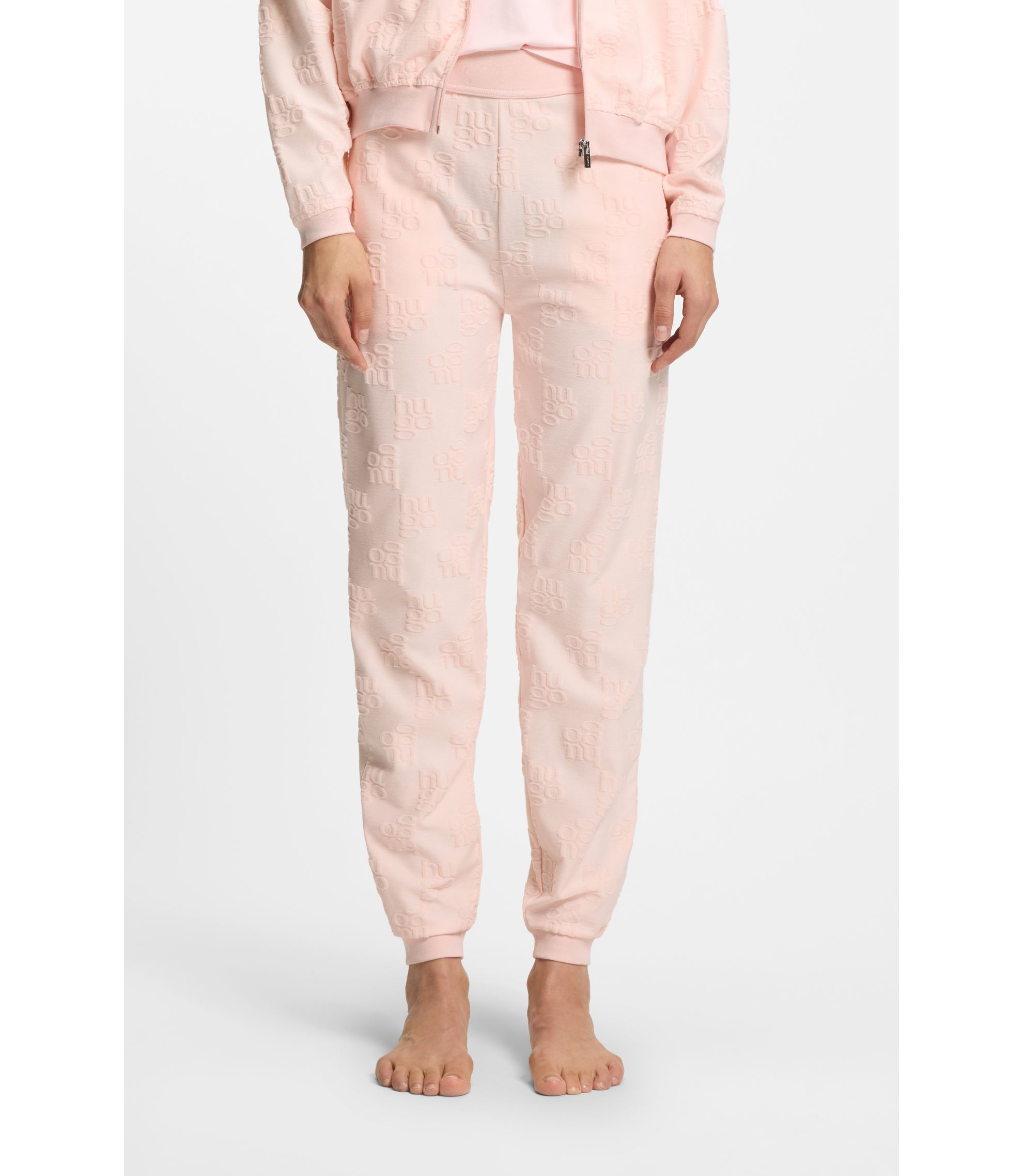 Jogginghose aus Baumwoll-Mix mit Allover-Logo-Muster