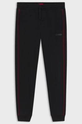 Stretch-cotton tracksuit bottoms with contrast piping, Black