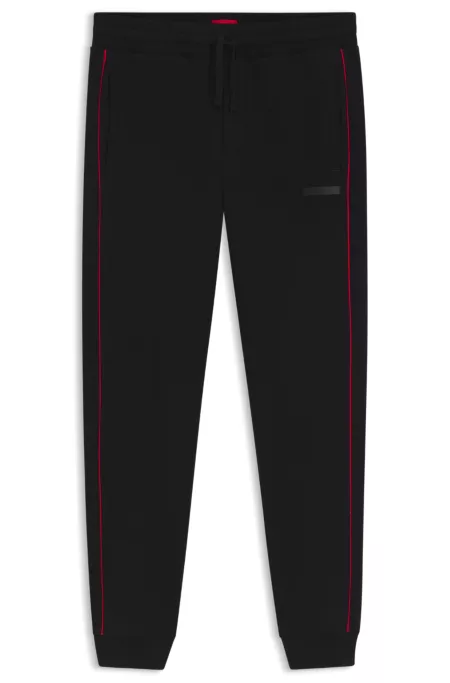 Bas de survêtement en coton stretch avec passepoils contrastants