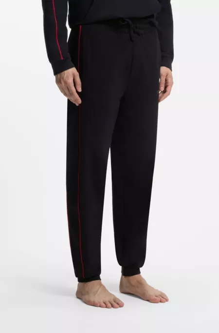 Pantalones de chándal de algodón elástico con ribetes en contraste