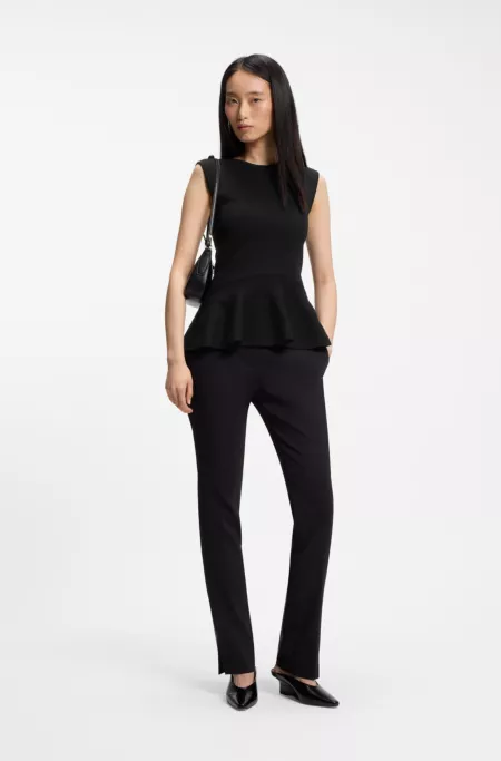 Sleeveless top with peplum hem