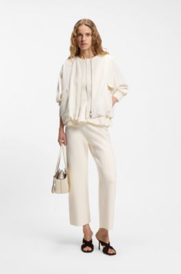 Sleeveless top with peplum hem, Natural