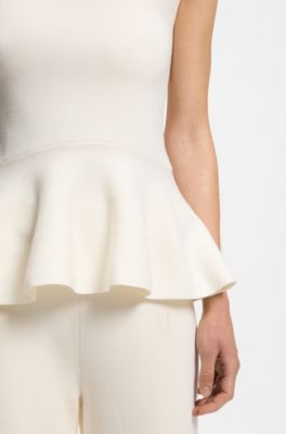 Sleeveless top with peplum hem, White