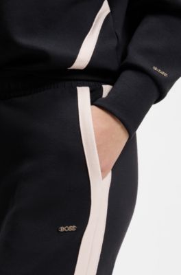 Tapered-fit tracksuit bottoms with contrast inserts, Black