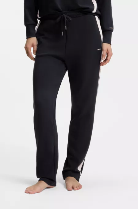 Tapered-fit tracksuit bottoms with contrast inserts