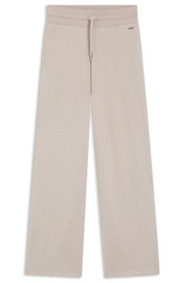 Melange-jersey tracksuit bottoms with logo plate, Light Beige