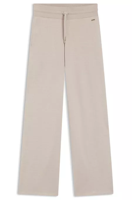 Melange-jersey tracksuit bottoms with logo plate