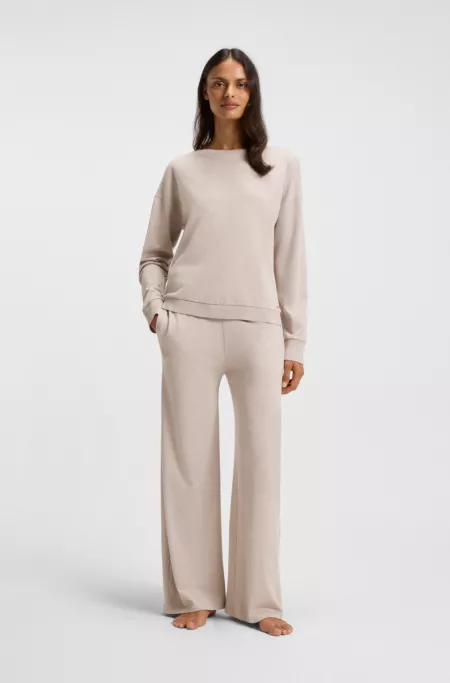 Melange-jersey tracksuit bottoms with logo plate