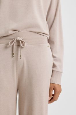 Melange-jersey tracksuit bottoms with logo plate, Light Beige