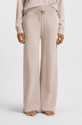 Melange-jersey tracksuit bottoms with logo plate, Light Beige