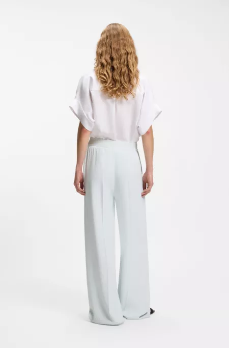 Relaxed-fit trousers in fluid crepe