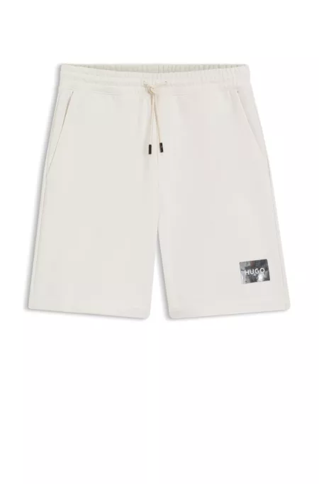 Cotton-terry shorts with tortoiseshell logo