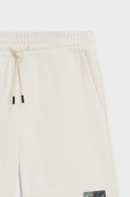Cotton-terry shorts with tortoiseshell logo, Natural