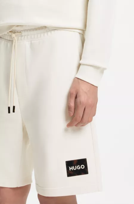 Cotton-terry shorts with tortoiseshell logo