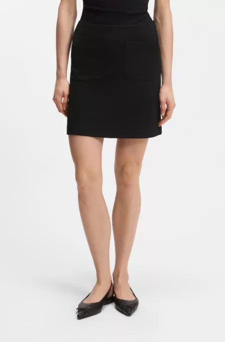 Punto Milano jersey mini skirt with front pockets