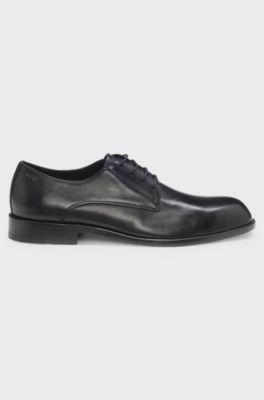 Leren derbyschoenen met reli&euml;flogo, Zwart