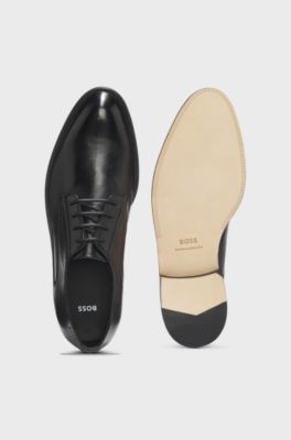 Leren derbyschoenen met reli&euml;flogo, Zwart
