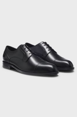 Leren derbyschoenen met broguedetails, Zwart