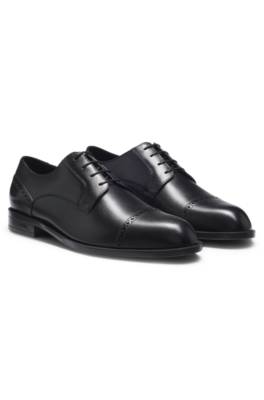 Leather Derby shoes with brogue details 1