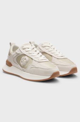 Sneakers aus Veloursleder und Kunstleder mit Eidechsen-Print, Hellbeige