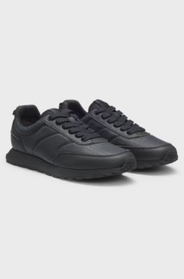 Low-top trainers with monogrammed uppers, Black