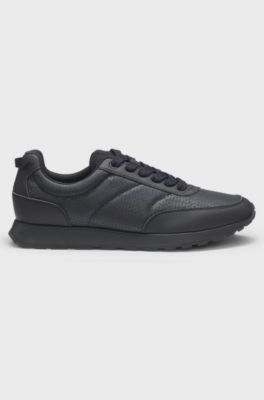Low-top trainers with monogrammed uppers, Black