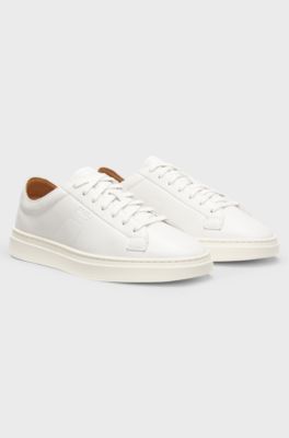 Low-top trainers in leather with embossed logo, White