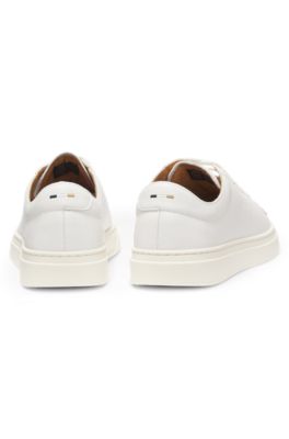 Low-top trainers in leather with embossed logo, White