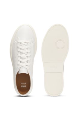 Low-top trainers in leather with embossed logo, White