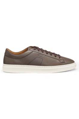 Low-top trainers in leather with embossed logo, Dark Brown