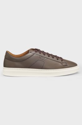 Low-top trainers in leather with embossed logo, Dark Brown