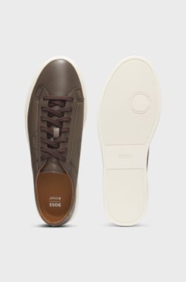 Low-top trainers in leather with embossed logo, Dark Brown