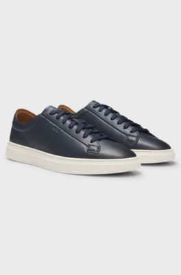 Low-top trainers in leather with embossed logo, Dark Blue