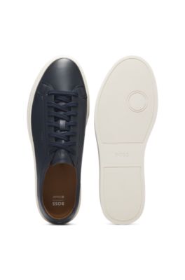Low-top trainers in leather with embossed logo, Dark Blue